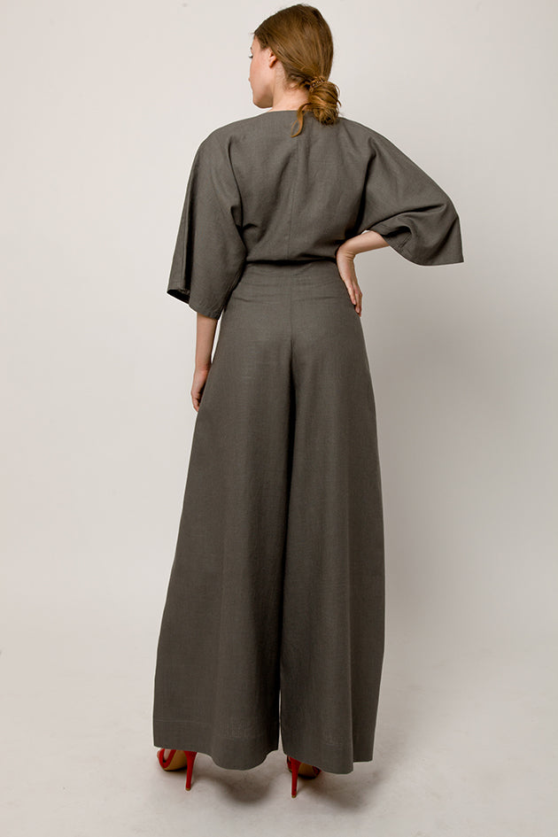 Model in gray wrap pants with front knot - back look