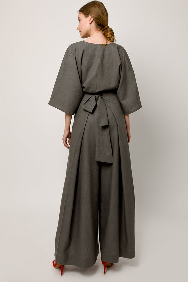 Model in total tiche look - Gray wrapover kimono top and gray pants - back