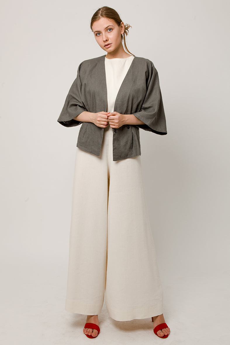 Model in tiche Gray wrapover kimono top - open,  and white pants