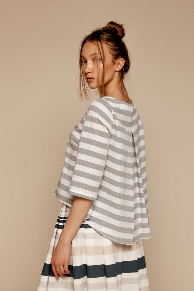 Gray-and-white back-pleat top